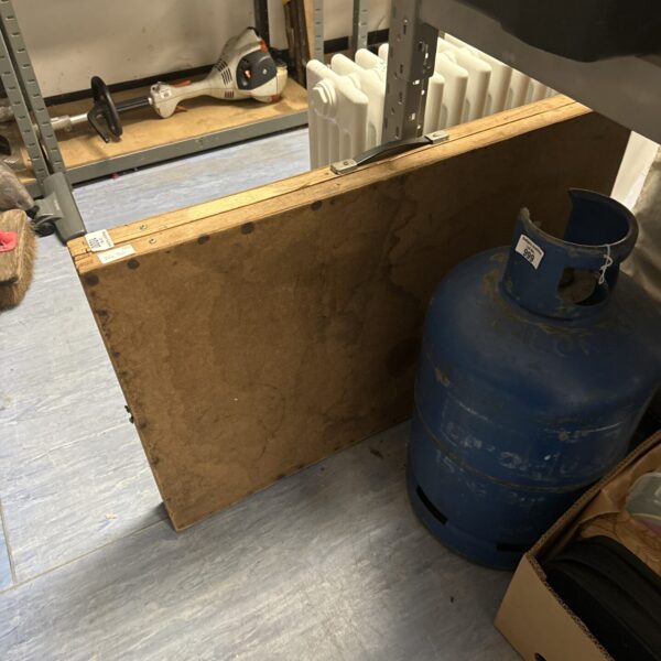Wooden folding decorators table in a workshop setting.