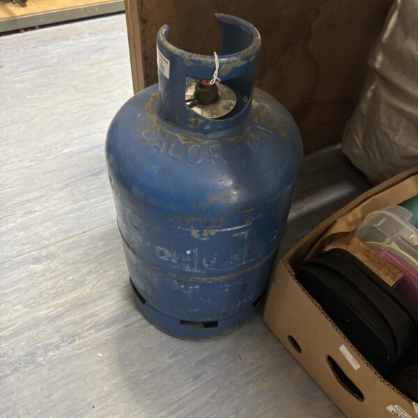 Blue Calor gas bottle, empty LPG cylinder for camping.