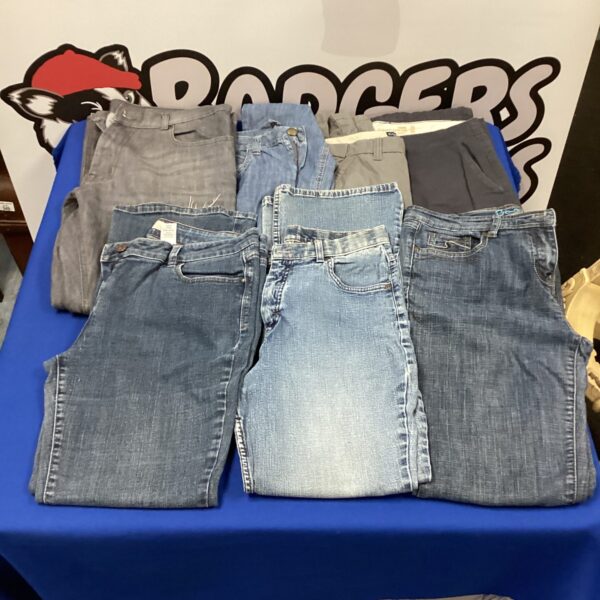 Mixed lot of men's jeans and trousers, including chinos and bootcut styles.
