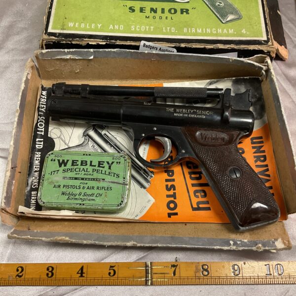 Vintage Webley Senior air pistol in original box, front view.