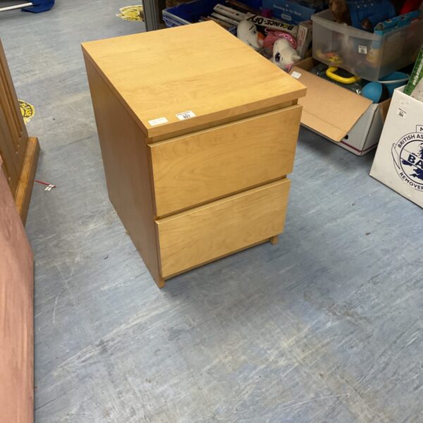 Wooden bedside cabinet with a single drawer, ideal for bedroom storage.