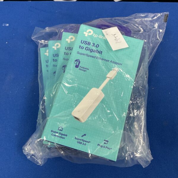 Four TP-Link USB 3.0 Gigabit Ethernet adapters in packaging.