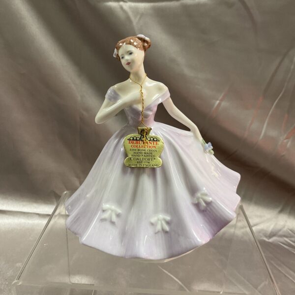 Front view of the Coalport Debutante Cassie porcelain figurine.