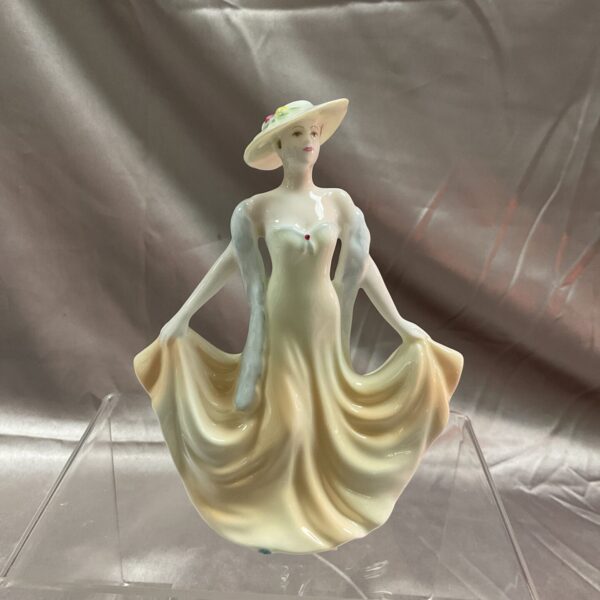 Vintage Coalport Encore figurine of a lady in a flowing gown.