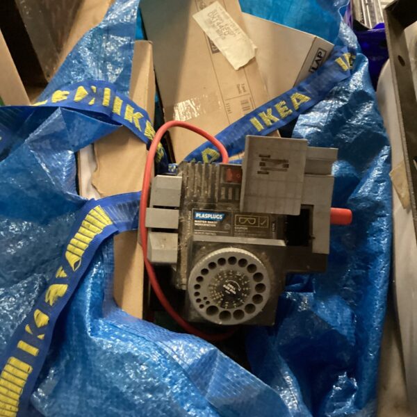Vintage Plasplug drill sharpener in a blue bag.