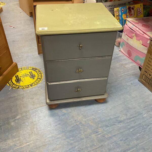 Vintage shabby chic bedside table with a single drawer.