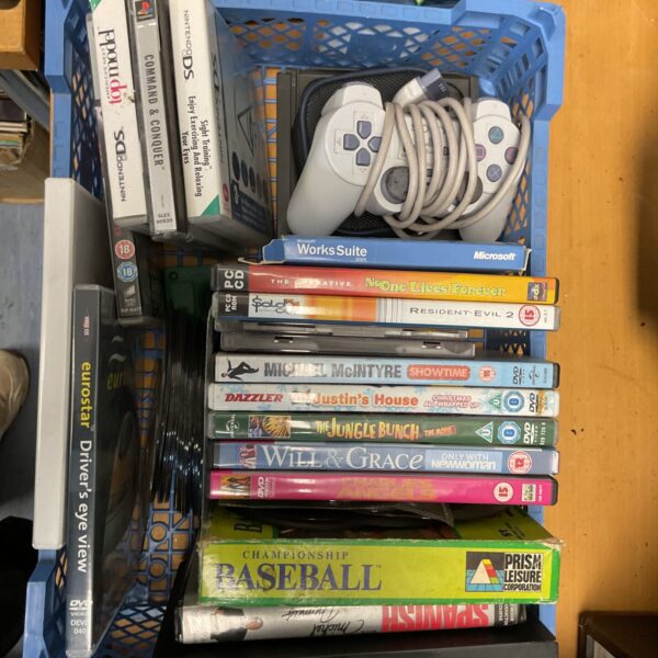 Mixed lot of PlayStation, Nintendo DS, and PC games with DVDs.