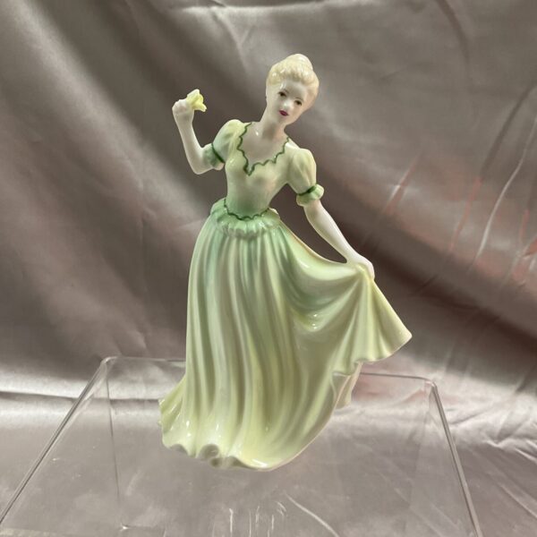 Vintage Coalport congratulations figure in pale green porcelain.