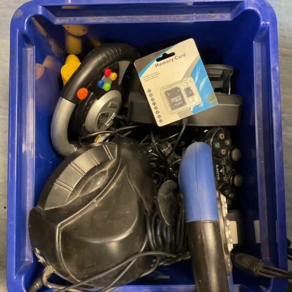 PlayStation controller lot with steering wheel and memory card.