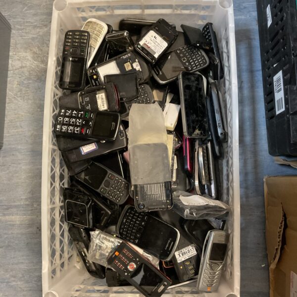 Tray of assorted mobile phones for spares or repair, including Blackberry and iPhone.