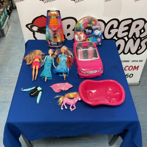 Mixed lot of Barbie dolls and sealed Trolls toys.
