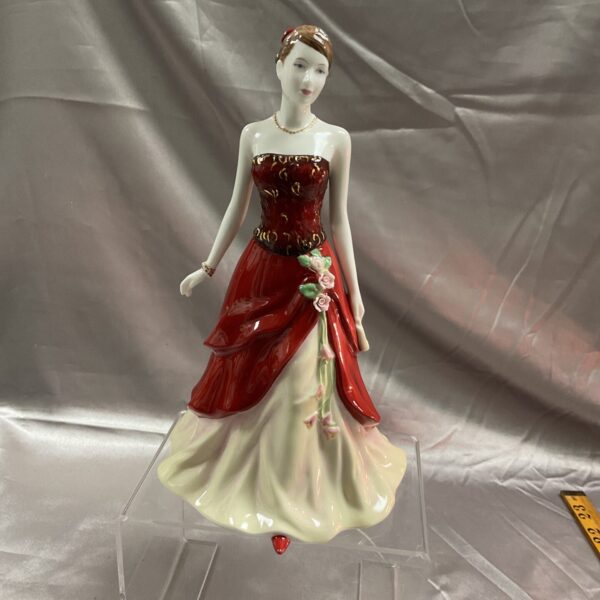 Royal Doulton Emily figurine, a beautiful porcelain sculpture.