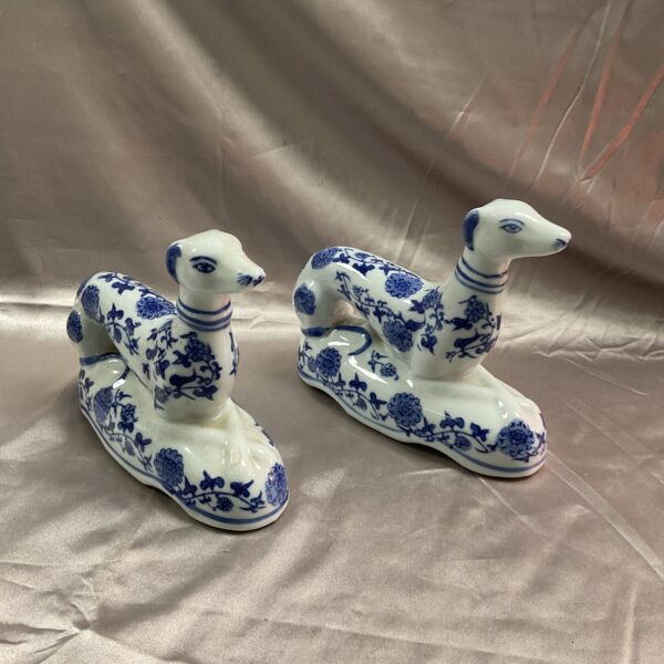 Antique Staffordshire blue and white greyhound pair, detailed ceramic dogs.