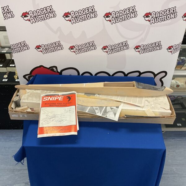 Vintage Snipe model plane kit with wooden components and plans.