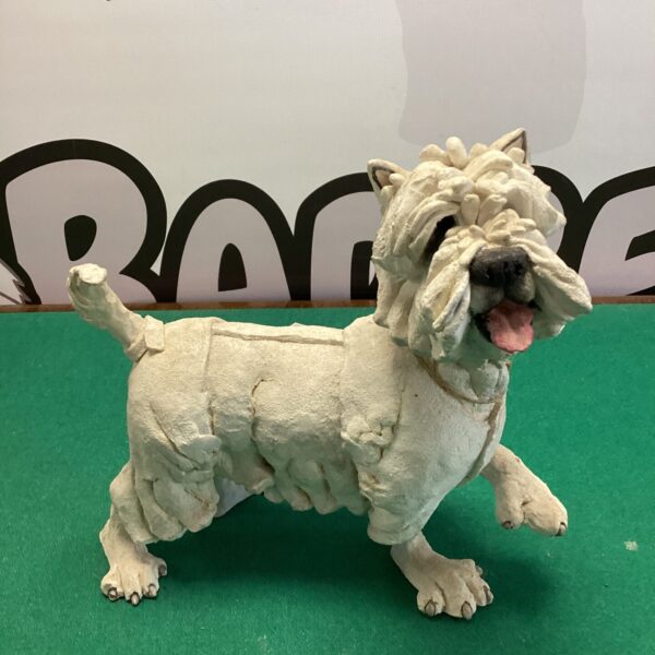 Hand sculpted clay dog, a charming folk art sculpture.