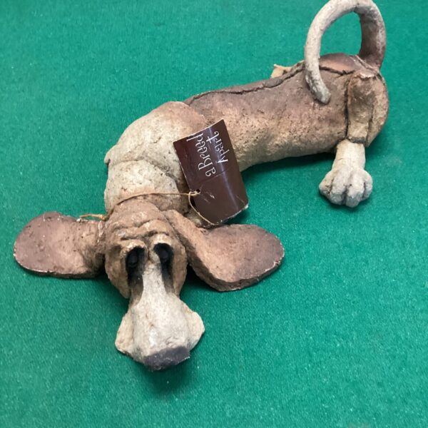 Charming hand-sculpted clay dog by Breed Apart, folk art style.