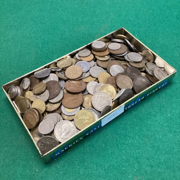 Tin filled with a diverse lot of foreign coins for collectors.