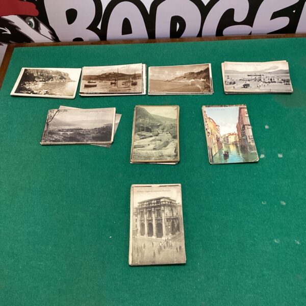 Vintage postcard collection featuring European and UK scenes.