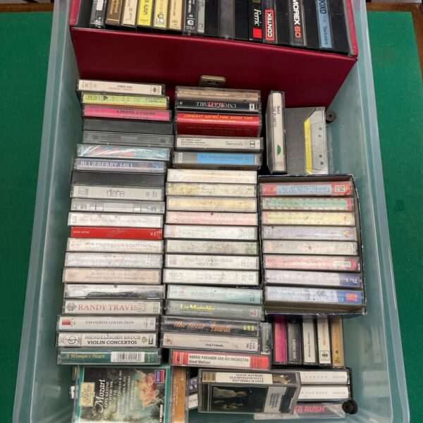 Vintage cassette tape collection with Dolly Parton and Shirley Bassey tapes.