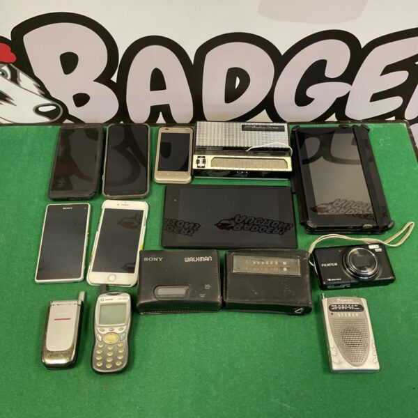 Mixed lot of vintage and modern electronics including smartphones and Walkmans.