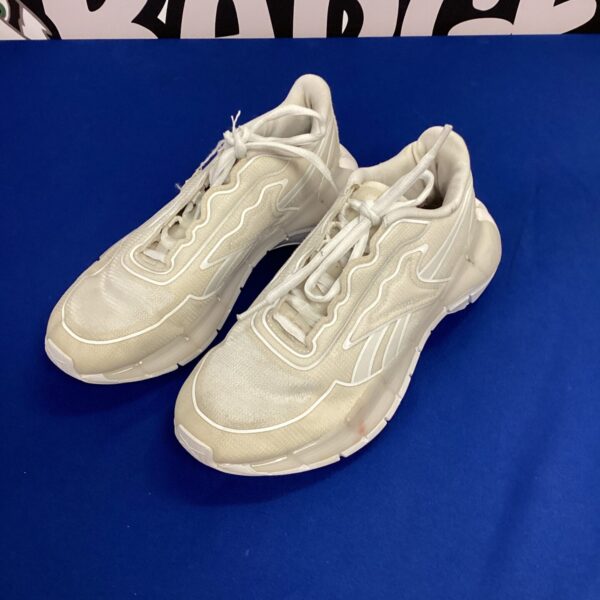 White Reebok size 6 trainers, classic athletic footwear.