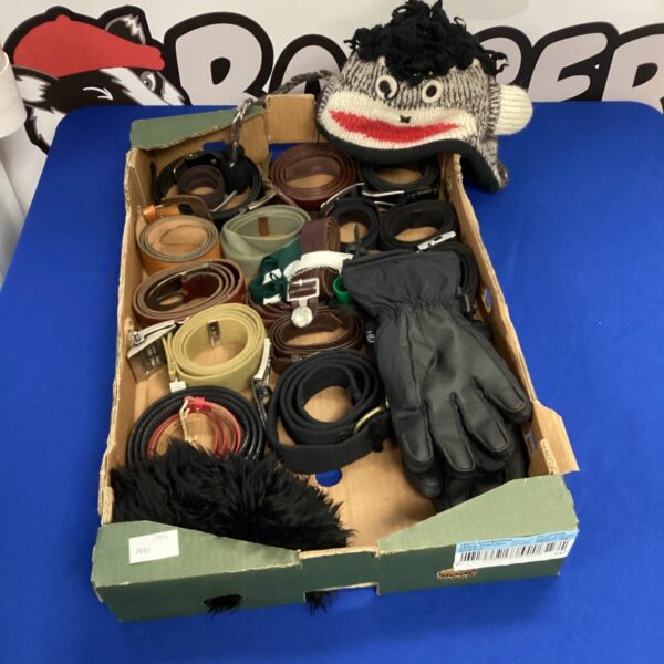 Mixed lot of belts, bobble hat, and gloves for winter wear.