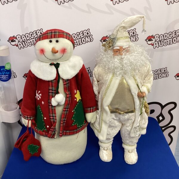 Detailed Santa and snowman figurine for Christmas decoration.