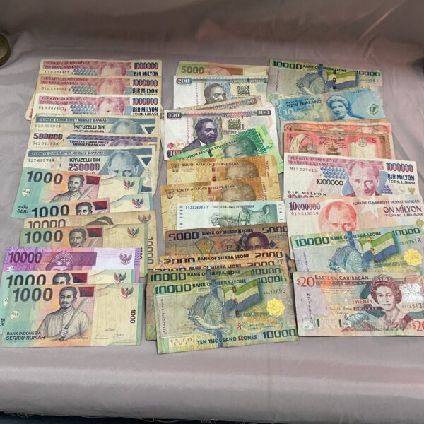 Collection of diverse overseas banknotes and foreign currency.