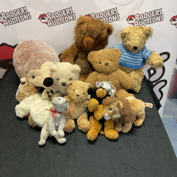 Assortment of vintage soft toys and plush animals.