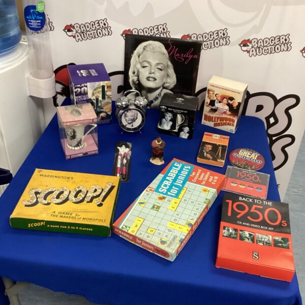 Marilyn Monroe collectibles lot including figurine and CDs.