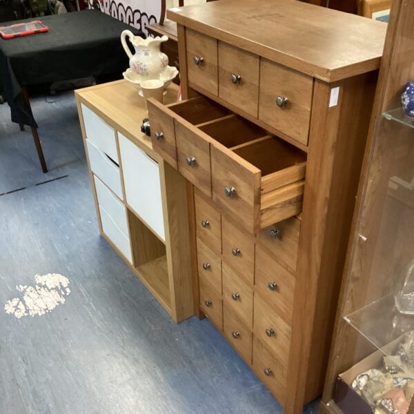 Tall six-drawer wood unit for bedroom storage, vintage style.