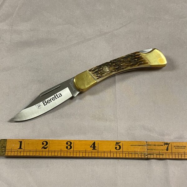 Vintage Beretta pocket knife with stag horn handle and Falcon blades.