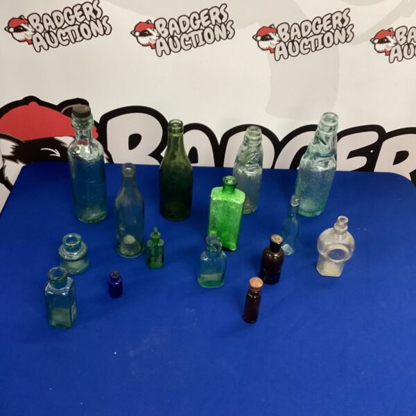 Assortment of vintage bottles, antique glass collection.