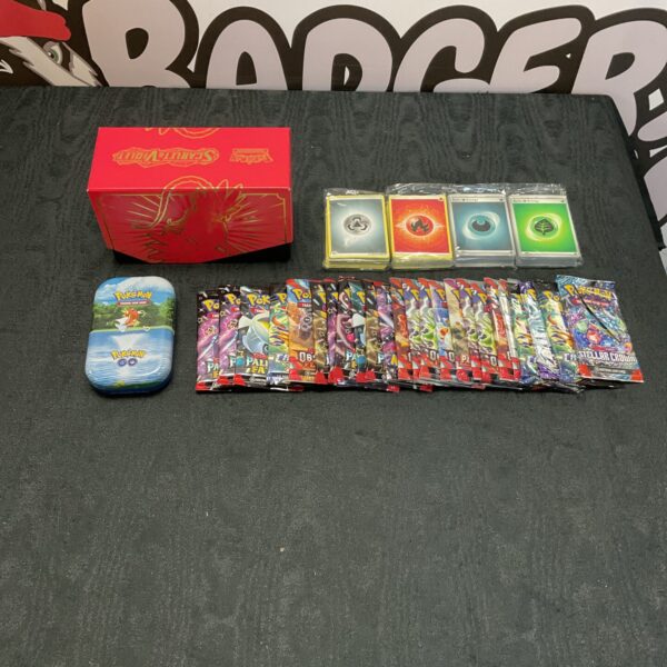 Pokemon card collection with unopened booster packs and a tin.
