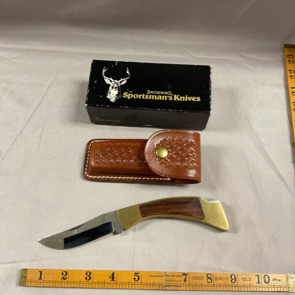 Vintage Browning Sportsman’s knife with leather sheath and original box.