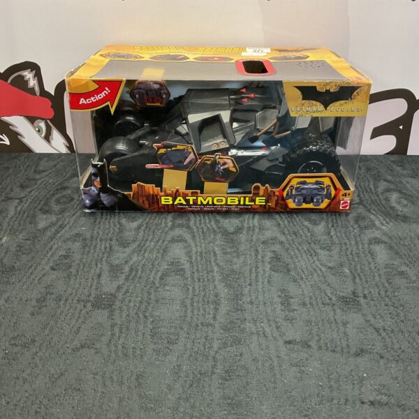 Mattel Batman Begins Batmobile in original packaging, collectible vehicle.