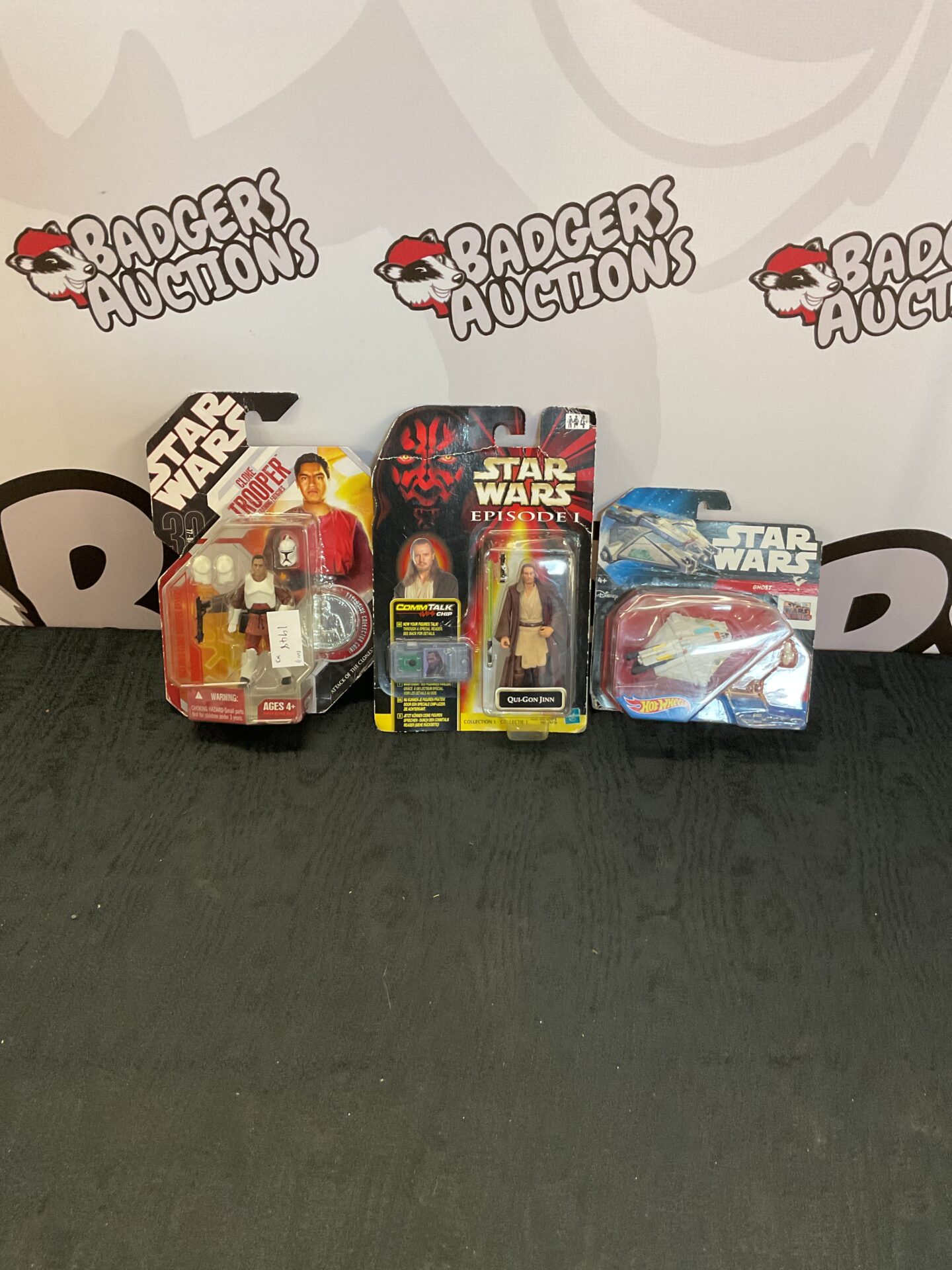 355 Two star wars figurines inc clone trooper, qui gon jinn and hotwheels model of star wars rebels ghost ship