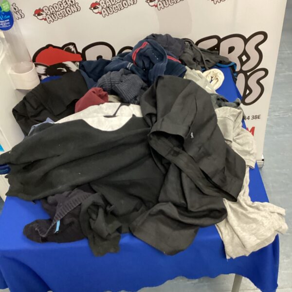 Mixed lot of kids clothing including jumpers and trousers.