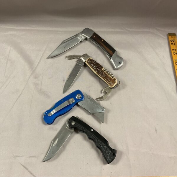 Vintage pocket knife lot with bone handle and steel blade.