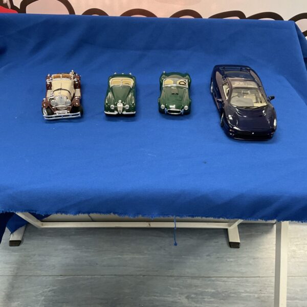 Diecast model cars lot including Burago and Maisto brands.