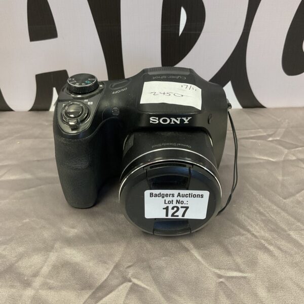 Front view of a silver Sony Cyber-shot digital camera.