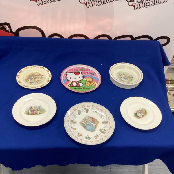 Vintage childrens pottery selection featuring Hello Kitty and Bunnykins designs.