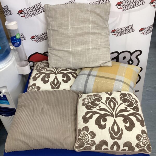 Close-up of a patterned cushion cover with a floral design.