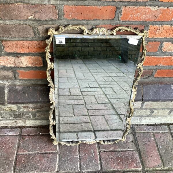 Ornate French style mirror with gilded frame.