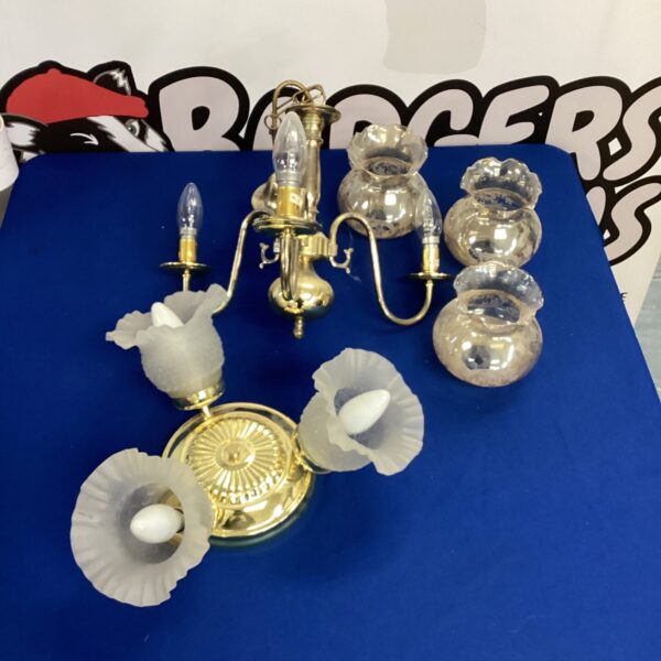 Vintage brass three-bulb ceiling lights for home decor.