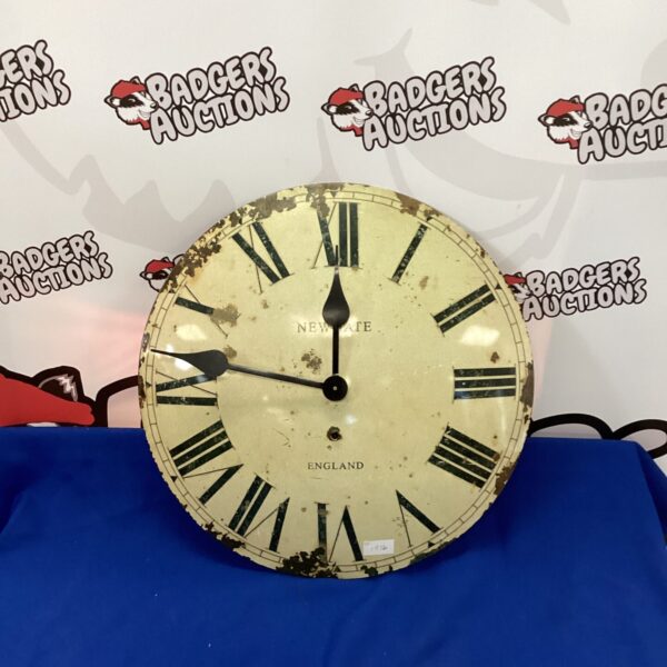 Cream Newgate clock face with black Roman numerals.