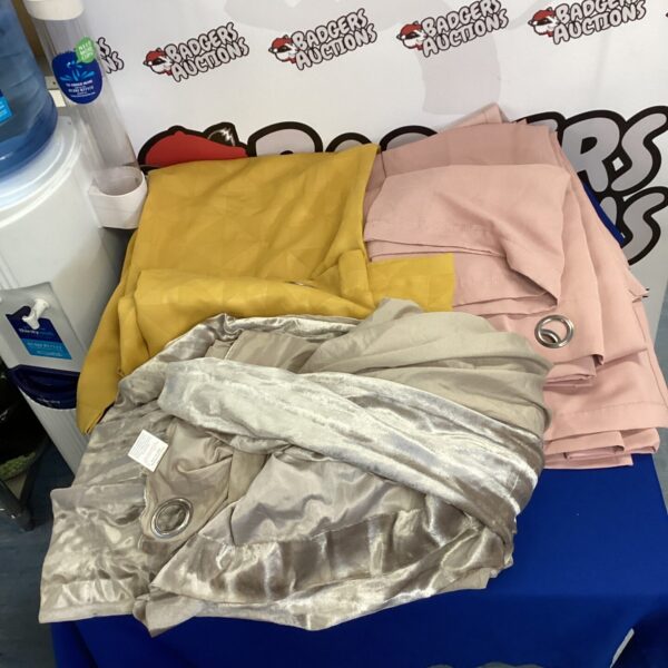 Four sets of full length curtains in pink and yellow.