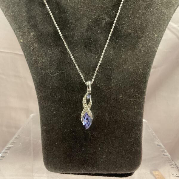 Elegant amethyst pendant necklace on a silver chain.