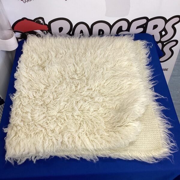 Cream Ikea shag pile rug measuring 70x130cm for a cosy living space.