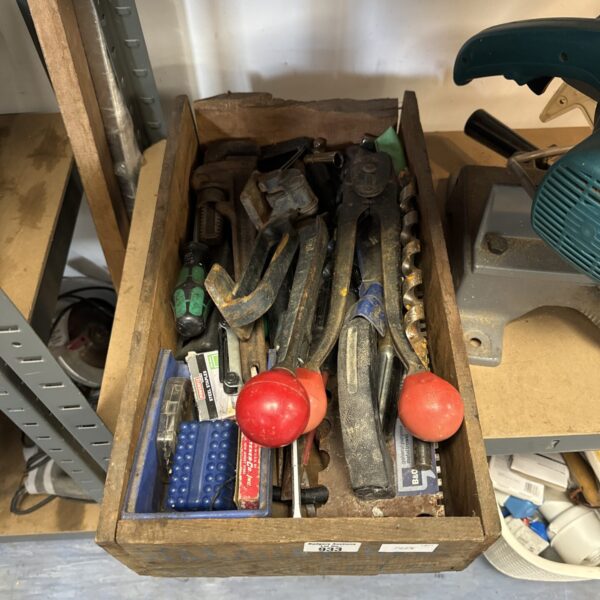 Vintage tool tray filled with assorted antique hand tools.